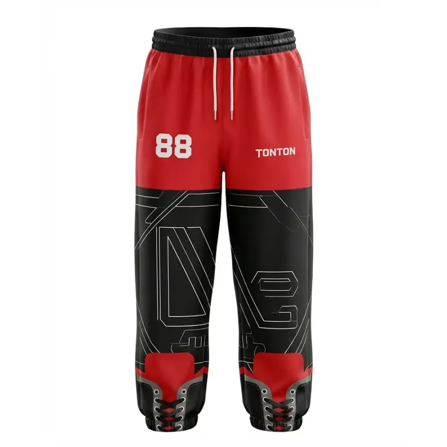 TONTON-Trainingshose für Hockey in Rot und Schwarz mit technischem Design – geometrisch sublimierte Leistungs-Hose fürs Off-Ice-Training