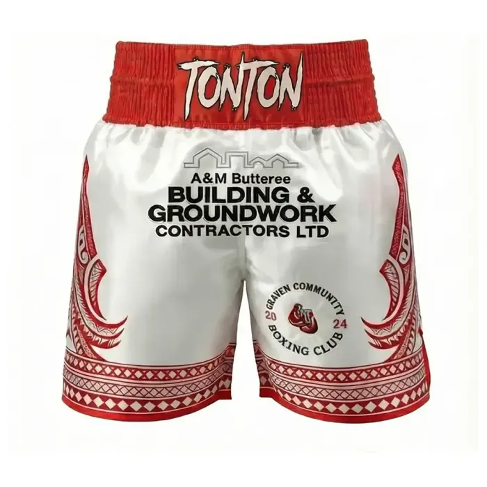 tonton white and red custom boxing shorts front view with sponsor text and traditional patterns fightwear
