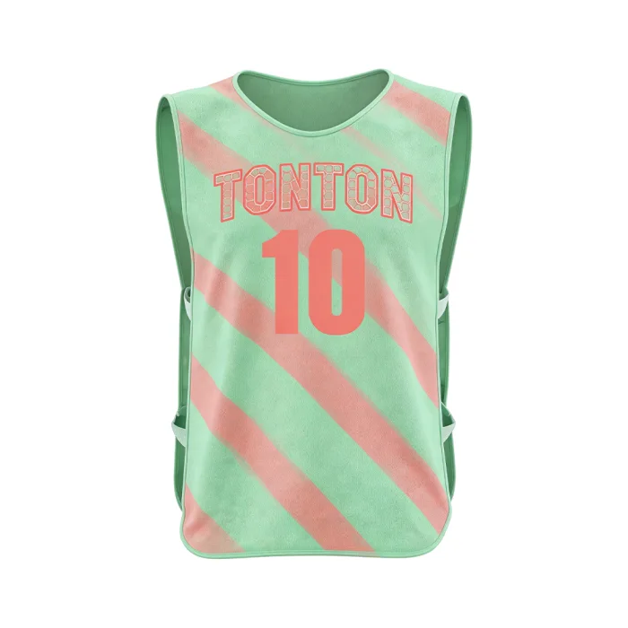 Front view of tonton mint green and pink striped soccer bib with red team branding and number 10.