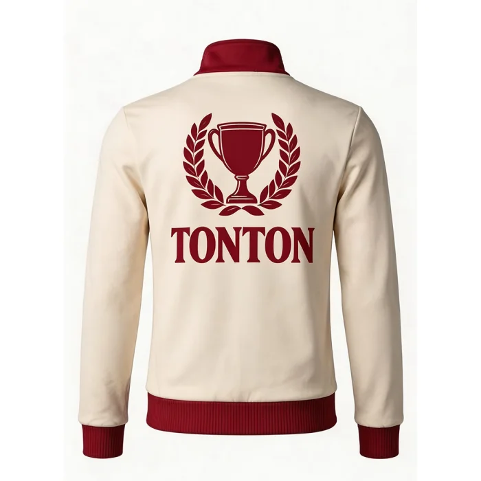 Back view of tonton cream soccer jacket featuring a large trophy and laurel wreath logo.