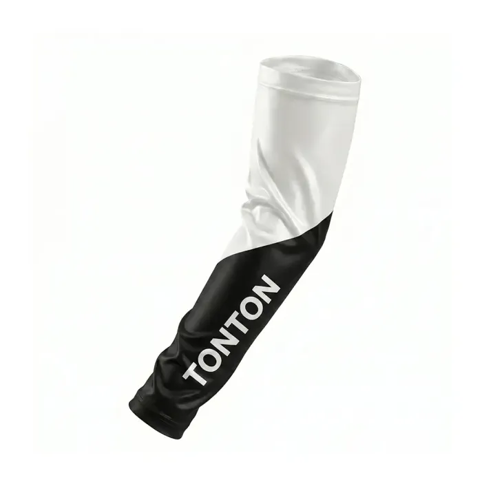 tonton sports arm sleeve with a sharp black and white diagonal color-block design and large vertical tonton branding.